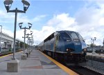 A BL36PH locomotive leads a four car Hyundai Rotem set into the southernmost station on the Tri-Rail Line of Miami Airport 